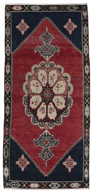 Full overhead view of the Red Navy Medallion Anatolian rug on a white background.