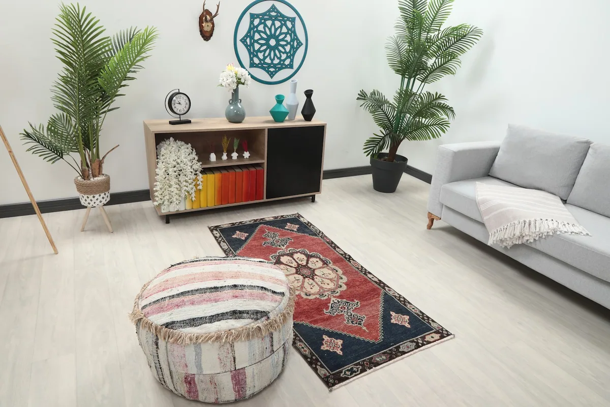 Overhead view of the rug in a room setting, capturing its full design and colors.