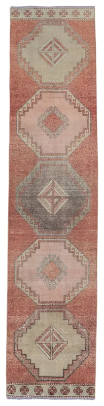 Full top view of the 2'7" x 12'3" vintage Anatolian runner rug with rust field and geometric medallions