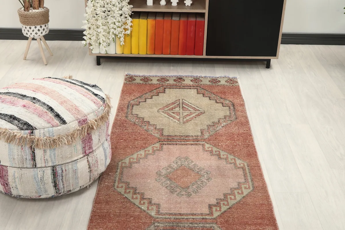 Overhead view of a section of the runner rug in a room, showing its placement relative to furniture