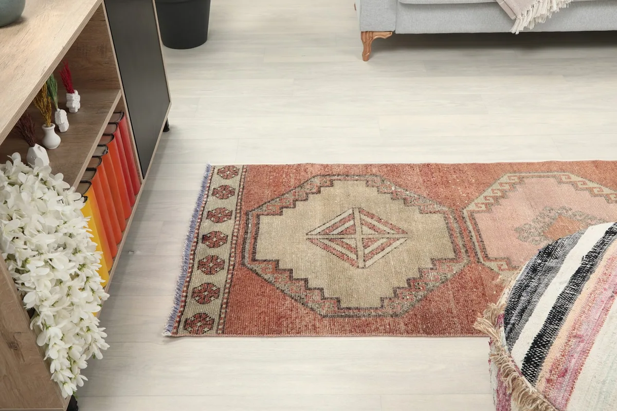 View of the runner rug extending down a hallway, showing its length and pattern