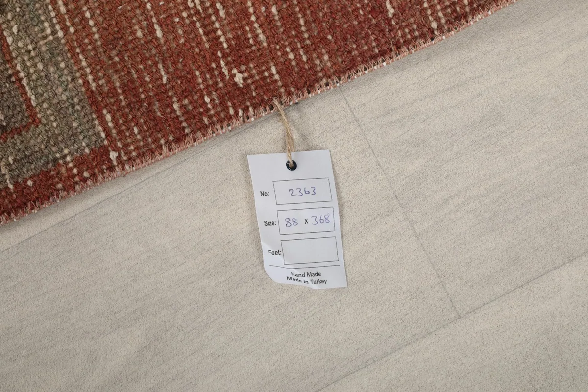 Product tag showing the rug's size and origin on the floor