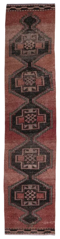 Full overhead view of the rust and black vintage Anatolian runner rug