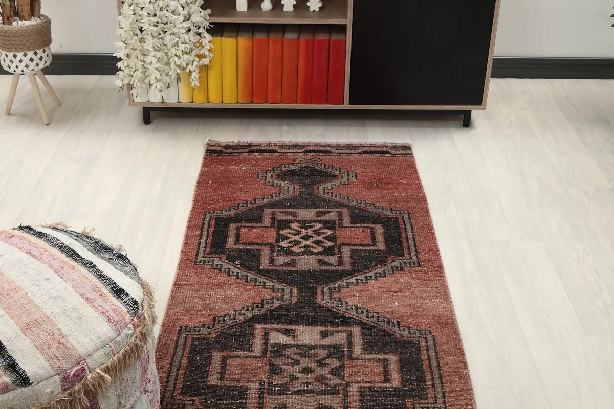 Overhead view of the runner rug in a room, focusing on the central design