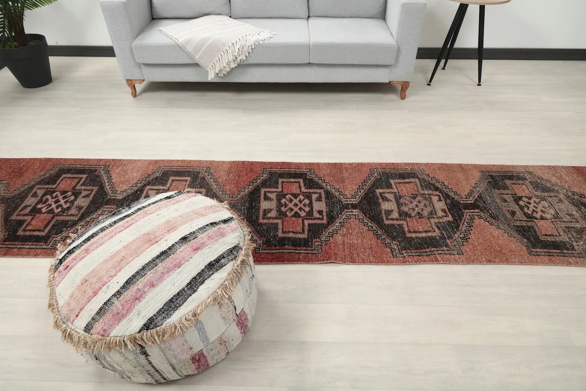 Straight-on view of the runner rug in a room, showing its full length and patterns