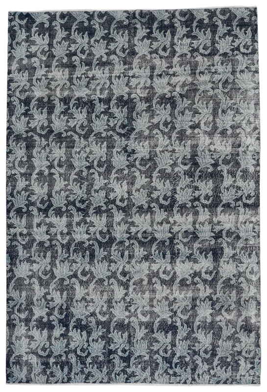 Full overhead view of the 6'7" x 10'0" vintage navy and gray floral Anatolian rug on a white background.