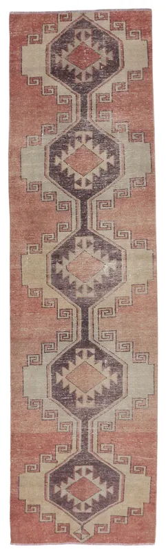 Full overhead view of the rust and beige geometric vintage Anatolian runner rug