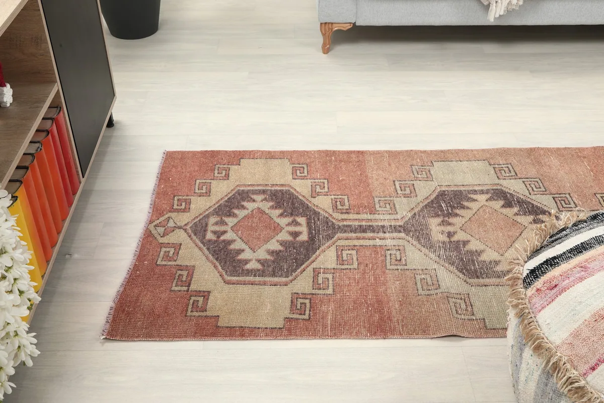 Angle shot of the runner rug in a room, capturing its length and design