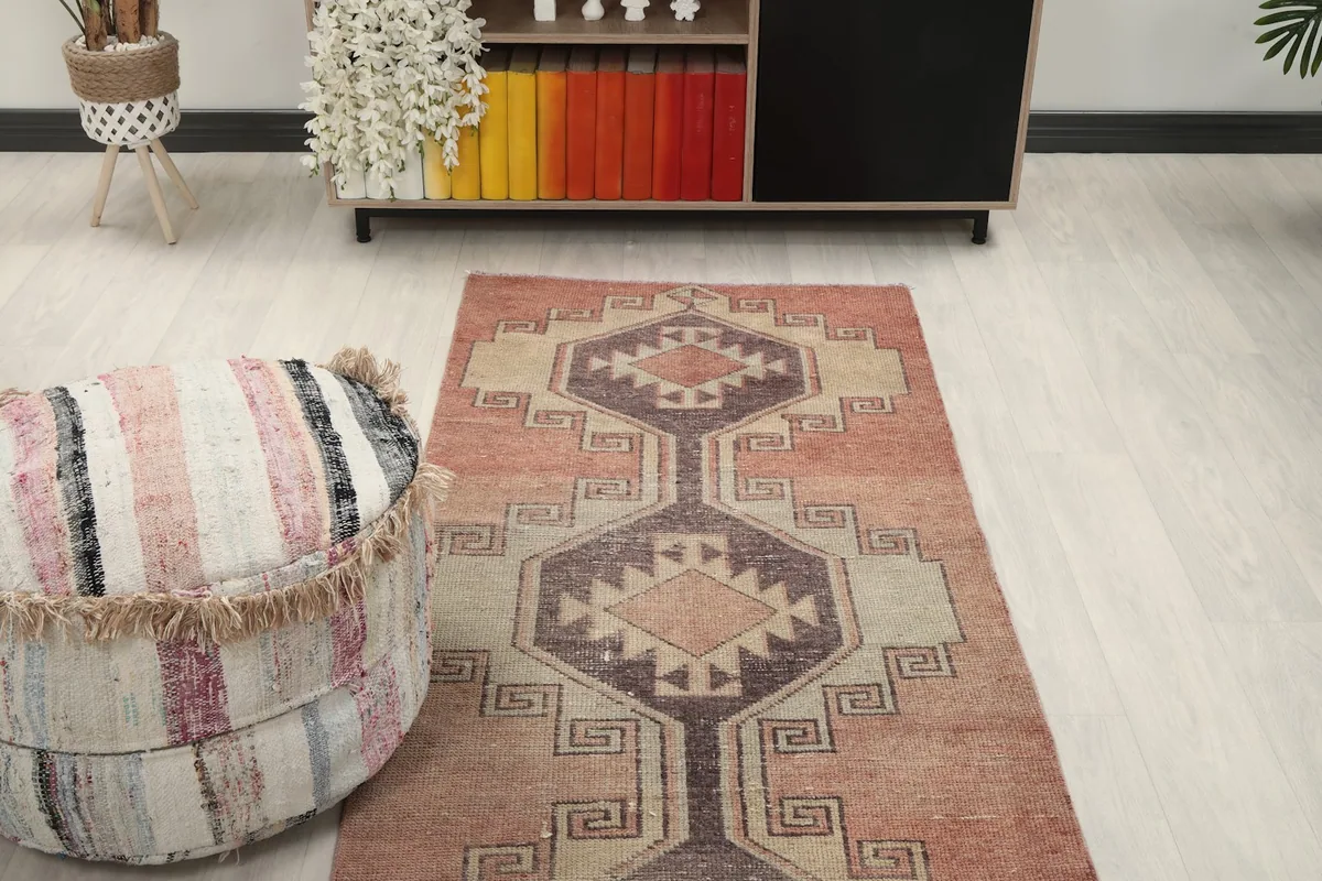 Overhead view of a section of the runner rug in a room, showing part of the pattern