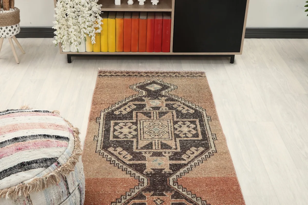 Overhead view of a section of the runner rug in a room, focusing on a single medallion