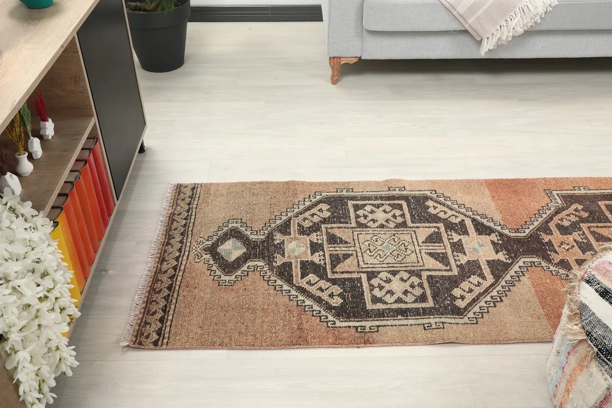 Runner rug extending through a room, showcasing its narrow profile and design