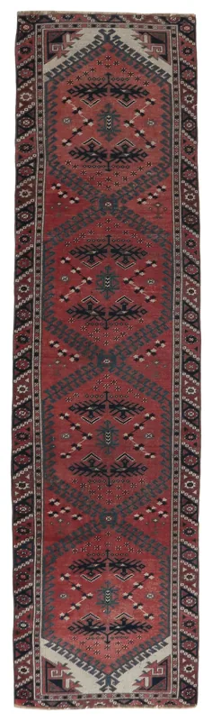 Full top view of the 2'5" x 9'7" rust and black tribal geometric runner on a white background.