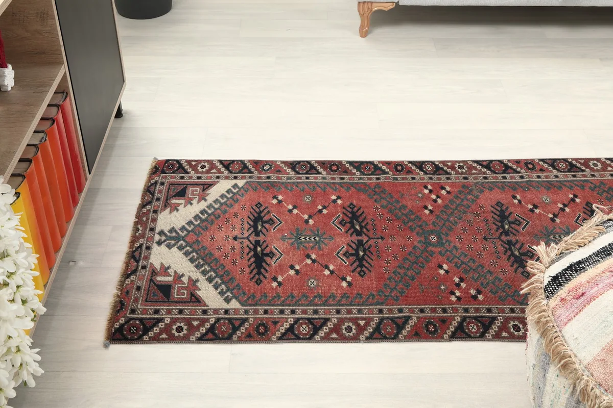 Angled overhead view of the runner rug stretching across the floor in a home decor setting.