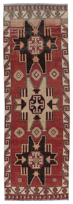 Full overhead view of the 2'11" x 9'0" vintage Anatolian runner rug with rust, cream, and black geometric patterns