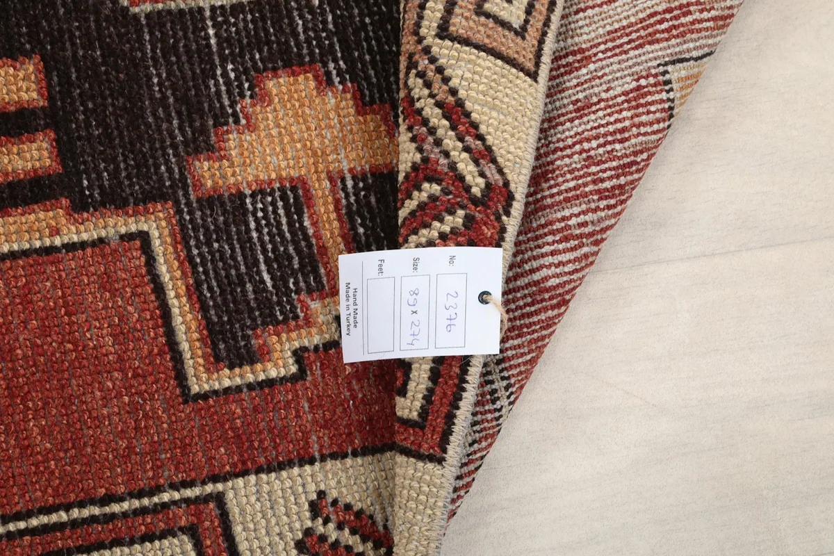 Folded rug section with a product tag, showing the thickness and construction