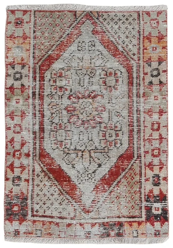 Full overhead view of the beige and red vintage Anatolian rug