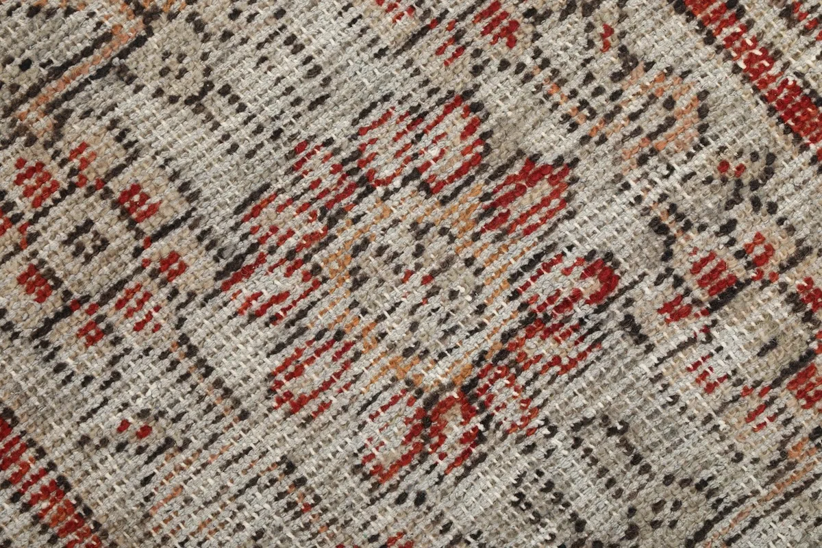 Close-up of the low wool pile and hand-knotted texture of the rug