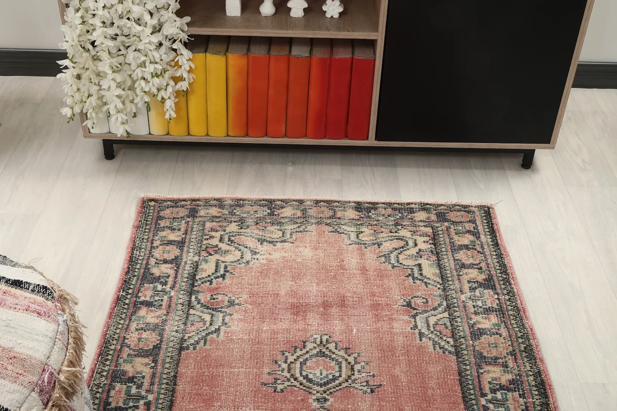 Overhead room view of the rug placed in front of a modern console table