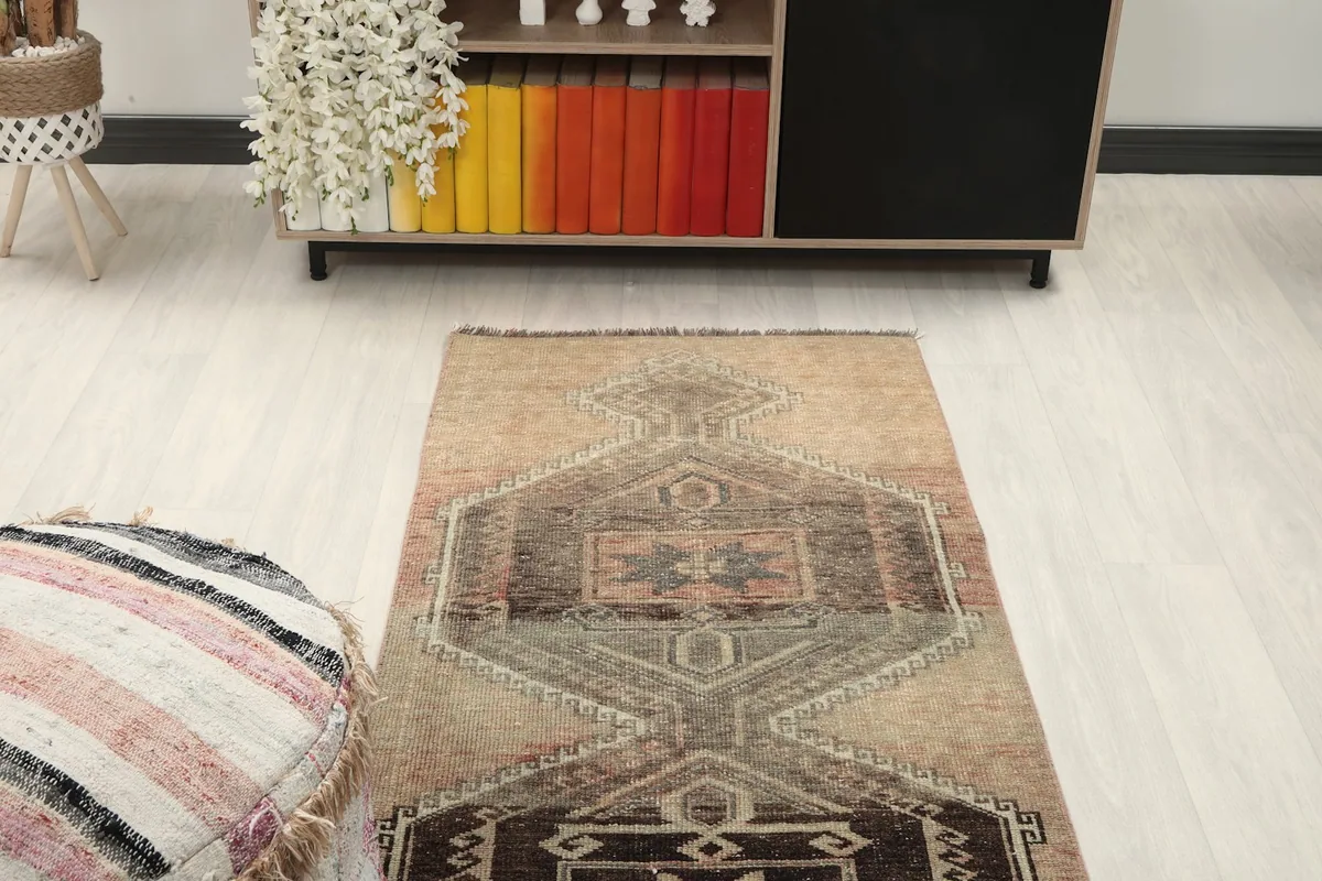 Top-down view of the rug's middle section, showcasing the repeating geometric medallions.