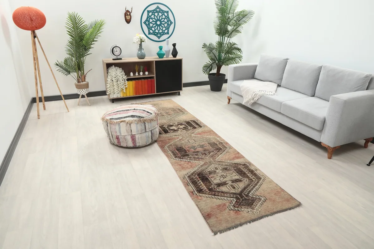 Runner rug viewed from a slight angle in a room setting, highlighting its colors and pattern.