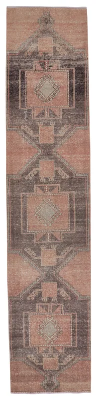 Full overhead view of the rose and charcoal tribal geometric vintage runner rug on a white background.