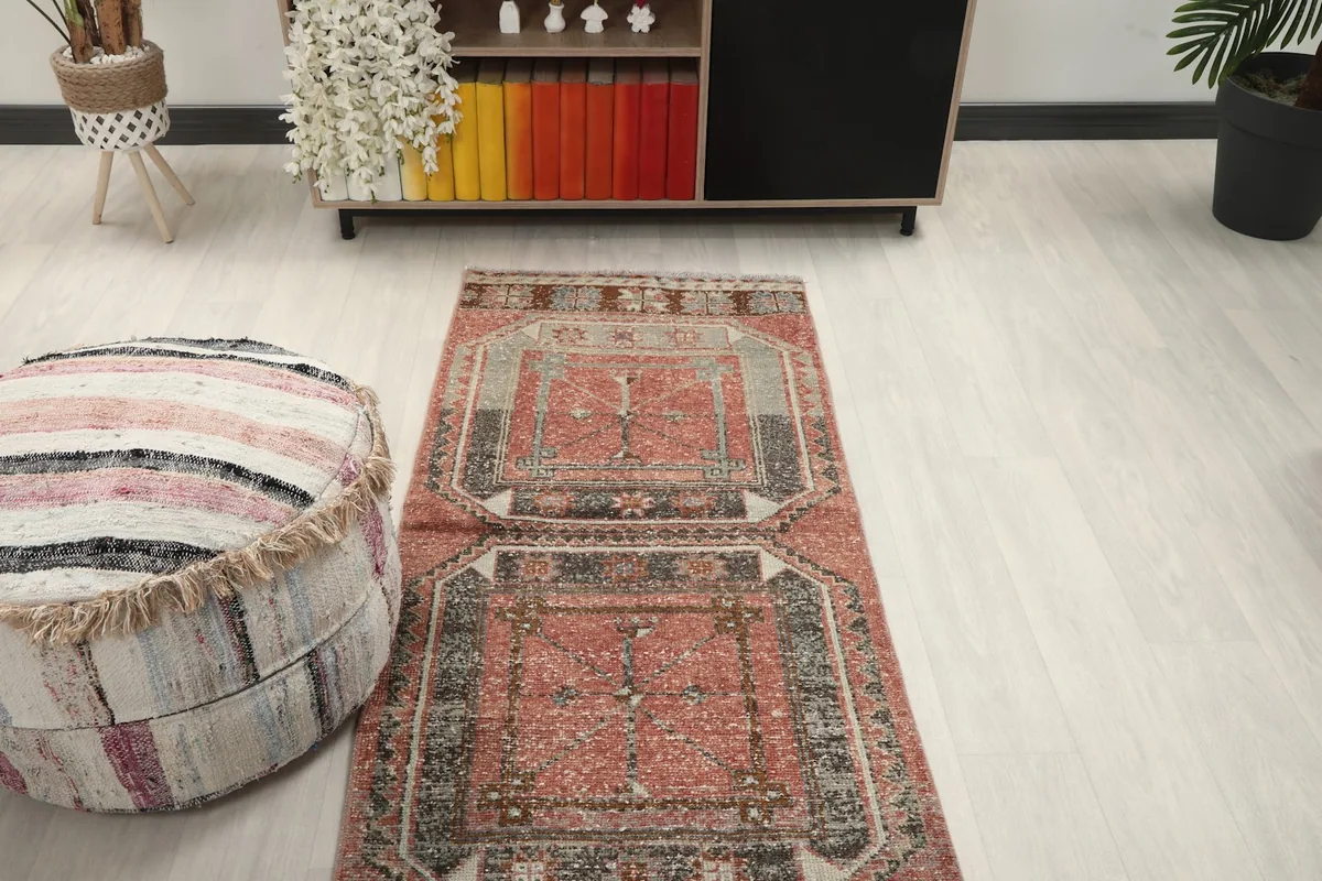 Overhead room view of the runner rug, showing the repeating panel design and room context.