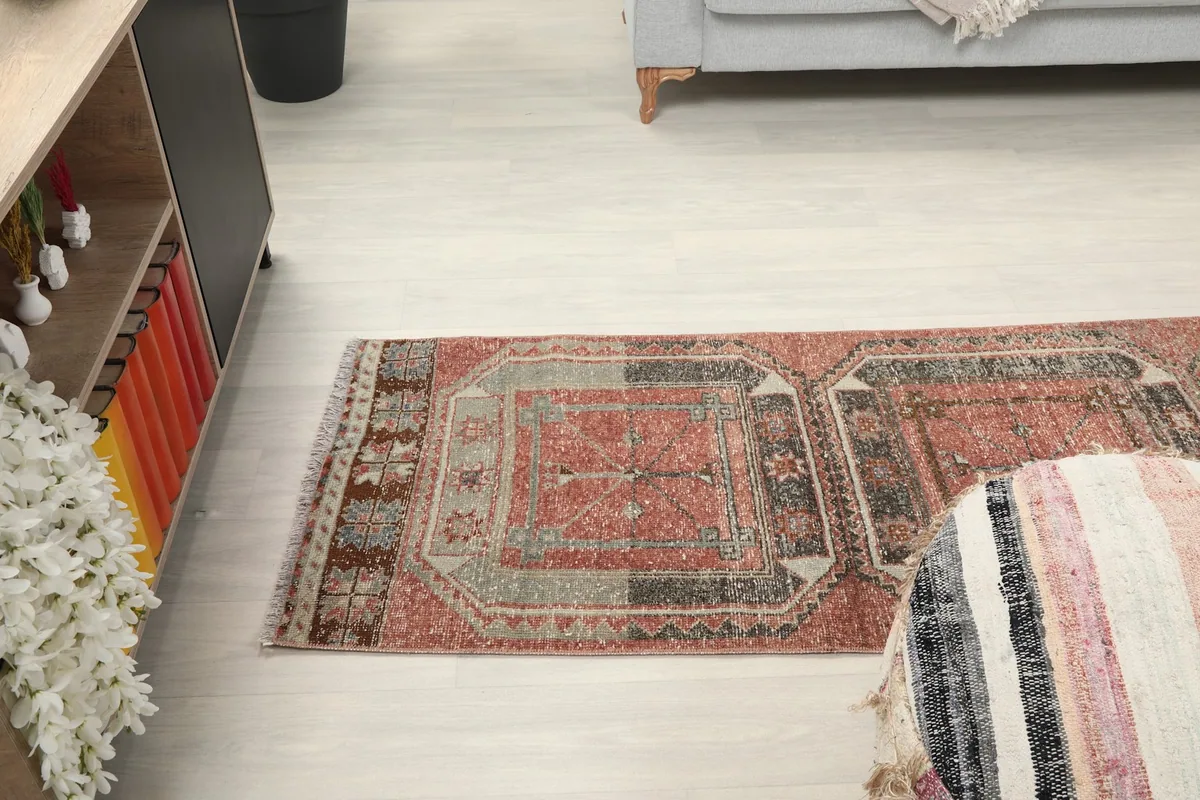 Angled room view of the runner rug extending into the space, showing its full length.
