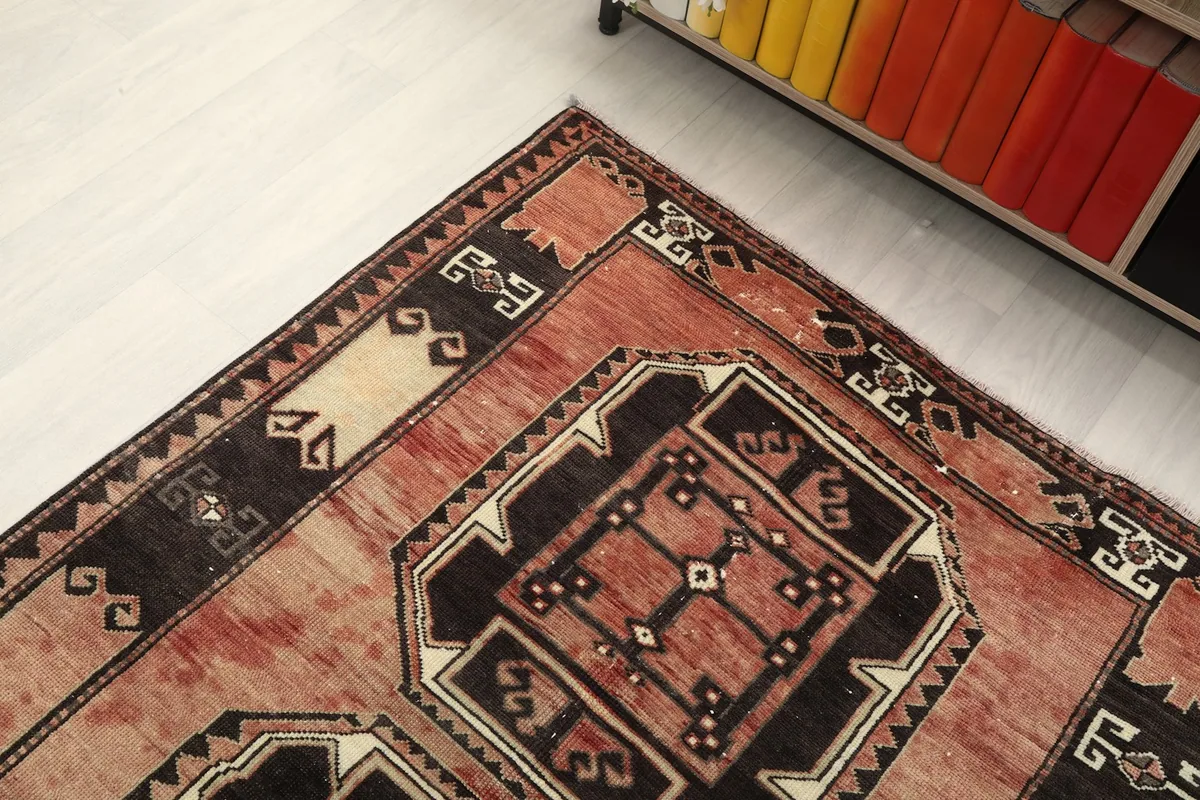 Angled view focusing on the upper portion of the runner and its detailed geometric border