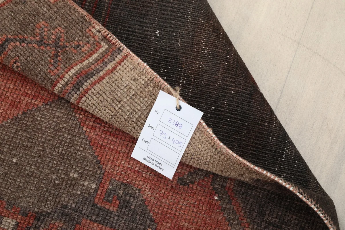 The rug's back with a product tag showing details like origin and size, confirming its authenticity.