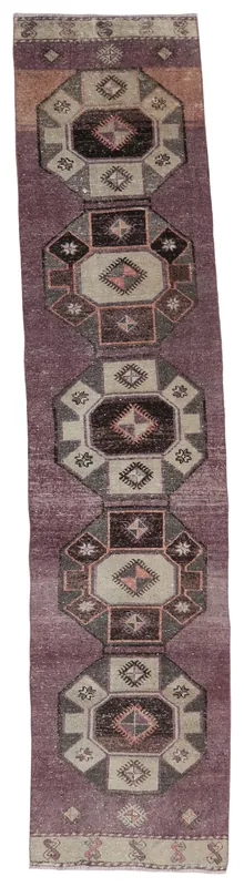 Full top view of the purple geometric Anatolian runner on a white background
