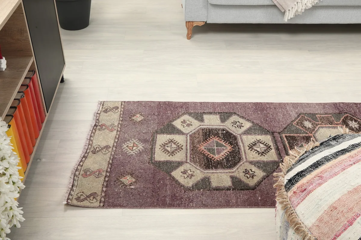 Angled view from above, showing the rug's placement in a room with furniture