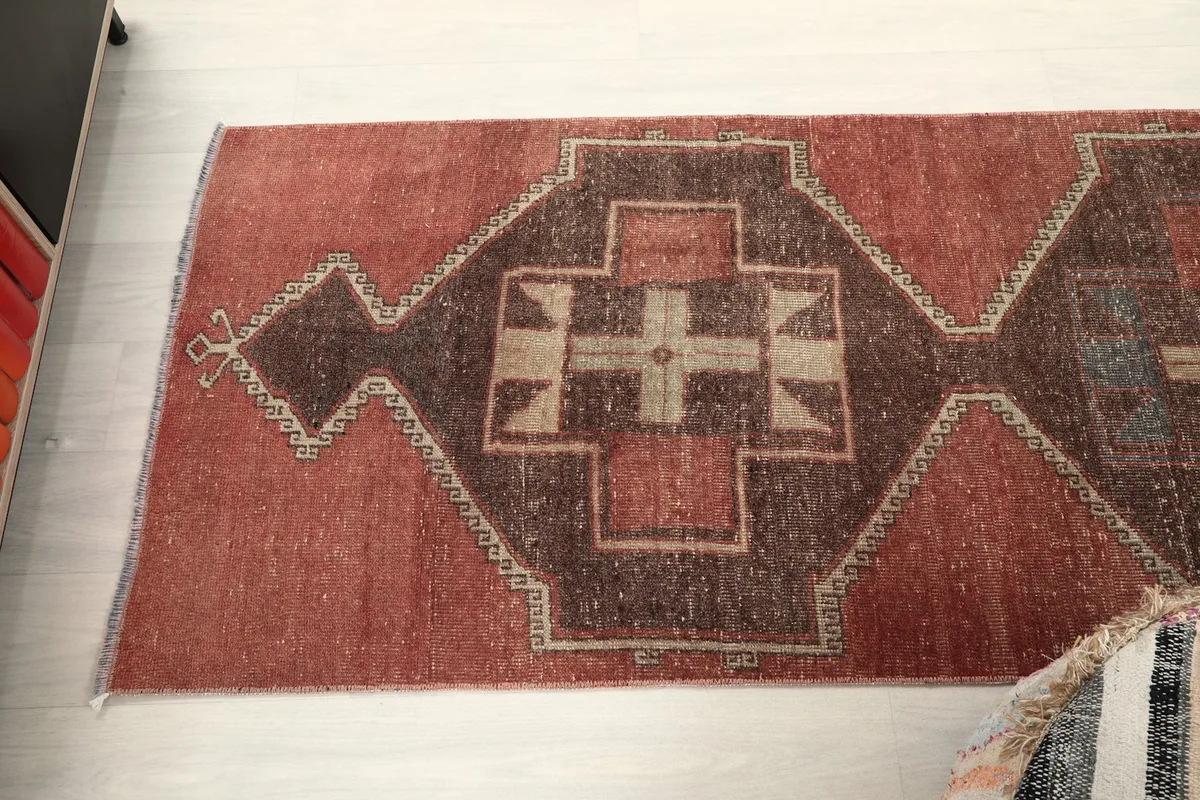 Angled view of the runner rug's upper section, highlighting the distinct geometric shapes