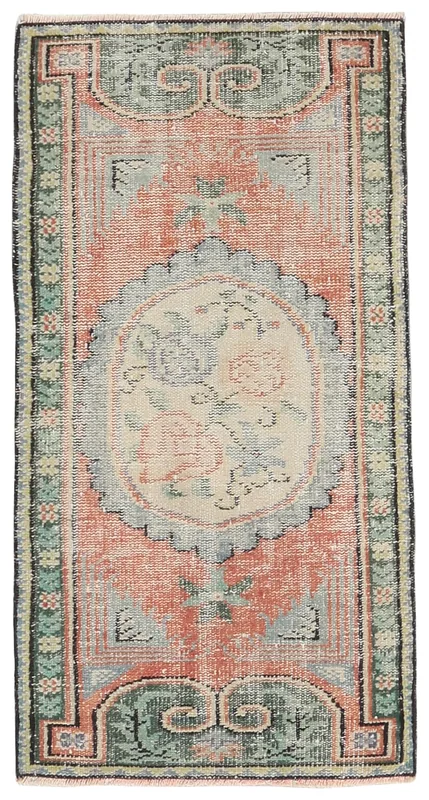 Full overhead view of the rust green floral medallion vintage Anatolian area rug