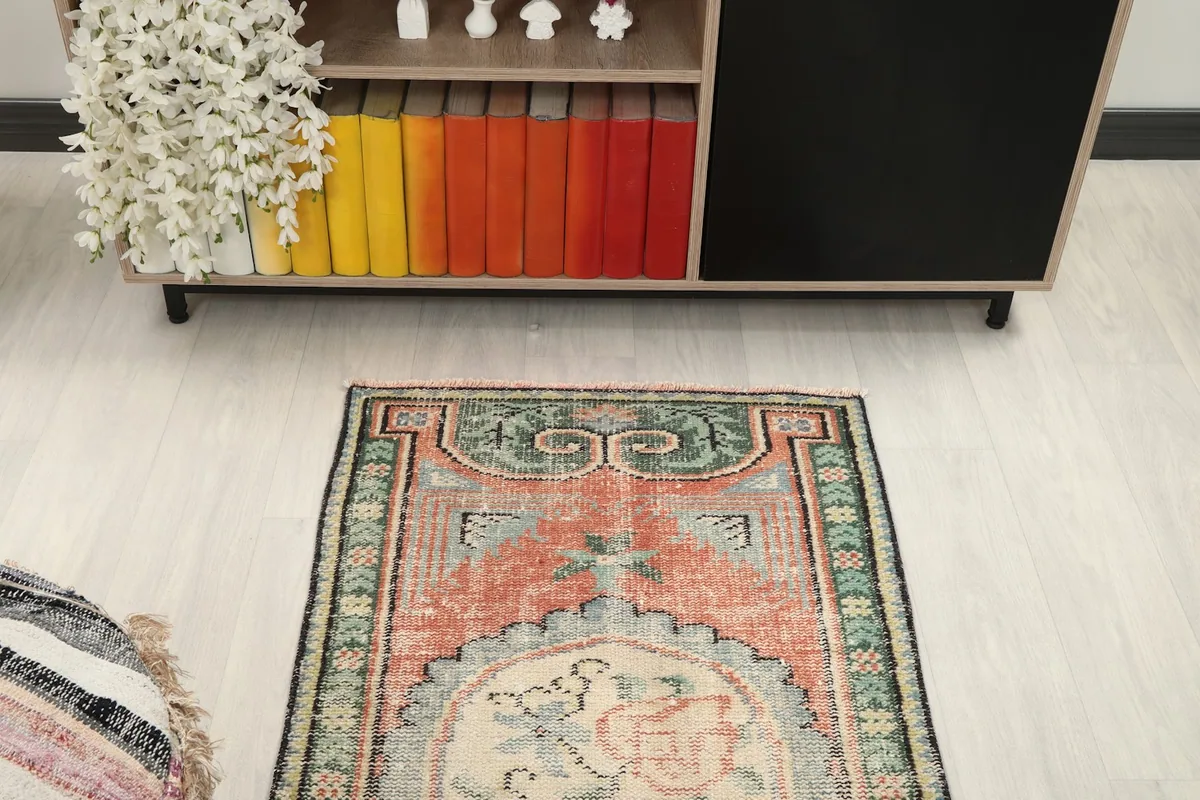 Overhead view of the rug from one end, highlighting its full design in a room
