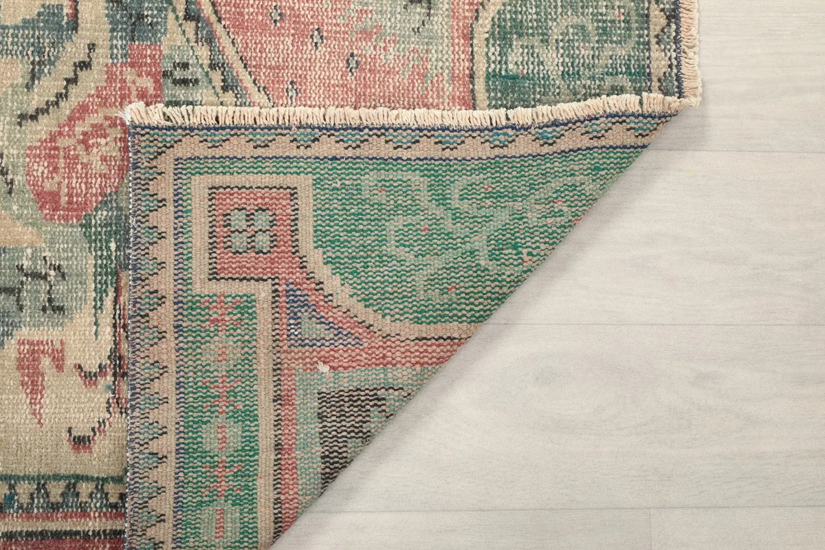 Another view of the rug's reverse side, showing the intricate hand-knotted construction.