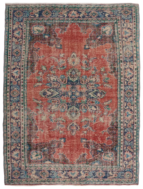Full top view of the 7x10 rust and blue vintage Anatolian medallion area rug.