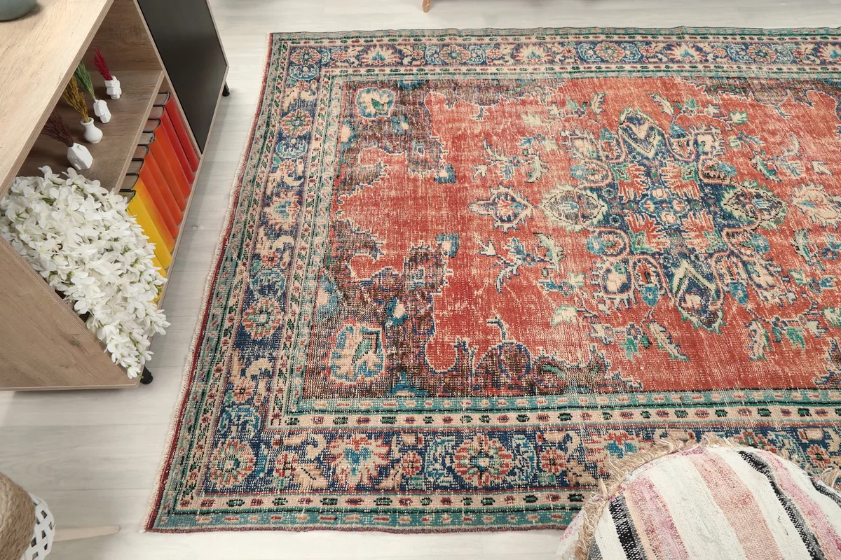 Wide angle view of the rug placed in a room, showing its scale and presence.