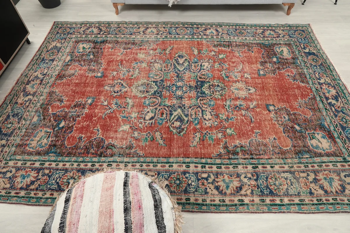 Overhead view of the rug, capturing its full design and distressed character.