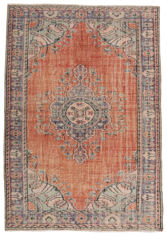 Full overhead view of the rust and blue vintage Anatolian area rug