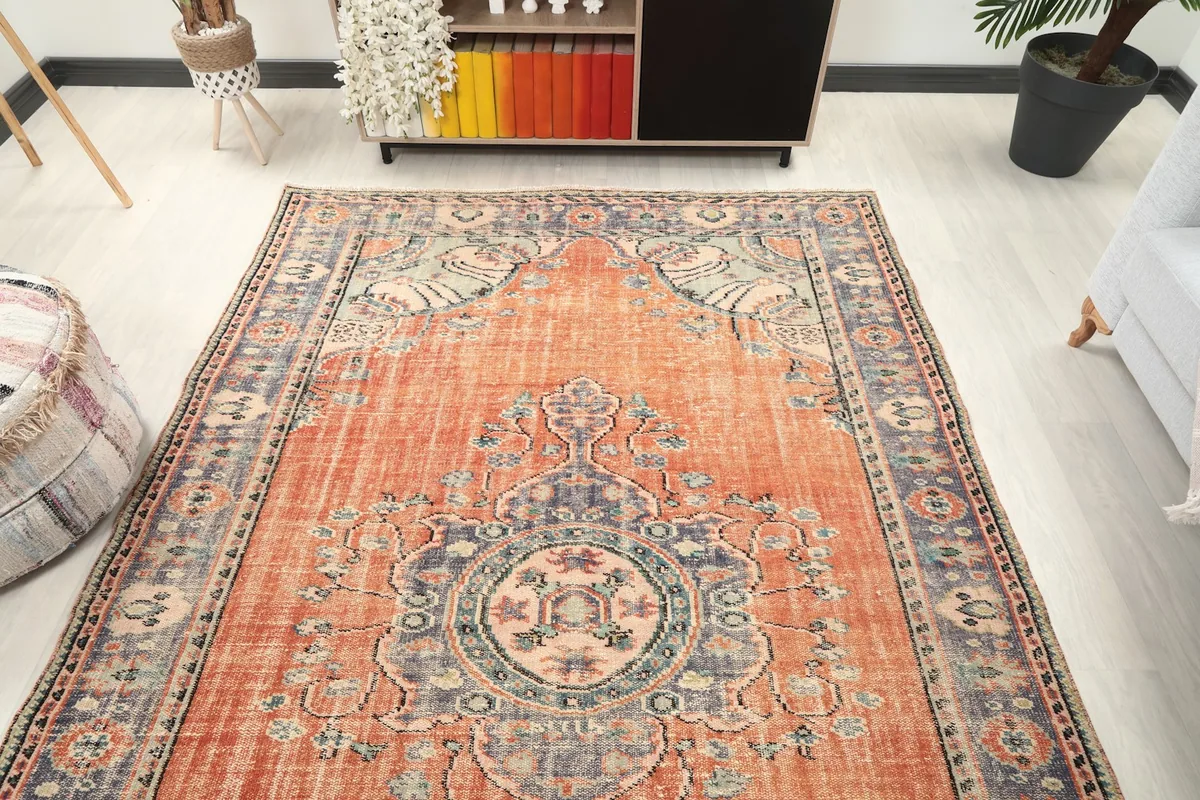 Overhead view of the rug in a room, highlighting its full design and colors