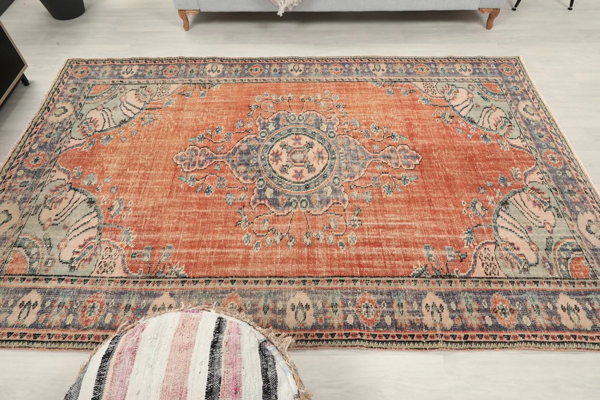 Full overhead view of the rug in a room, emphasizing its size and pattern