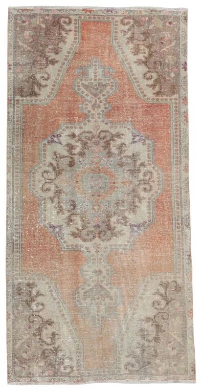 Full overhead view of the warm orange and beige medallion Anatolian rug