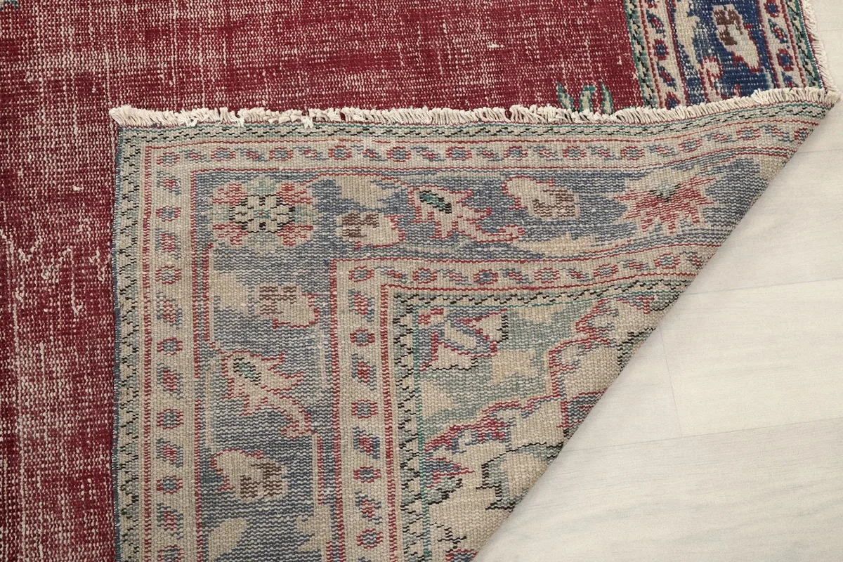Detail of the rug's fringe and the back, showing the craftsmanship