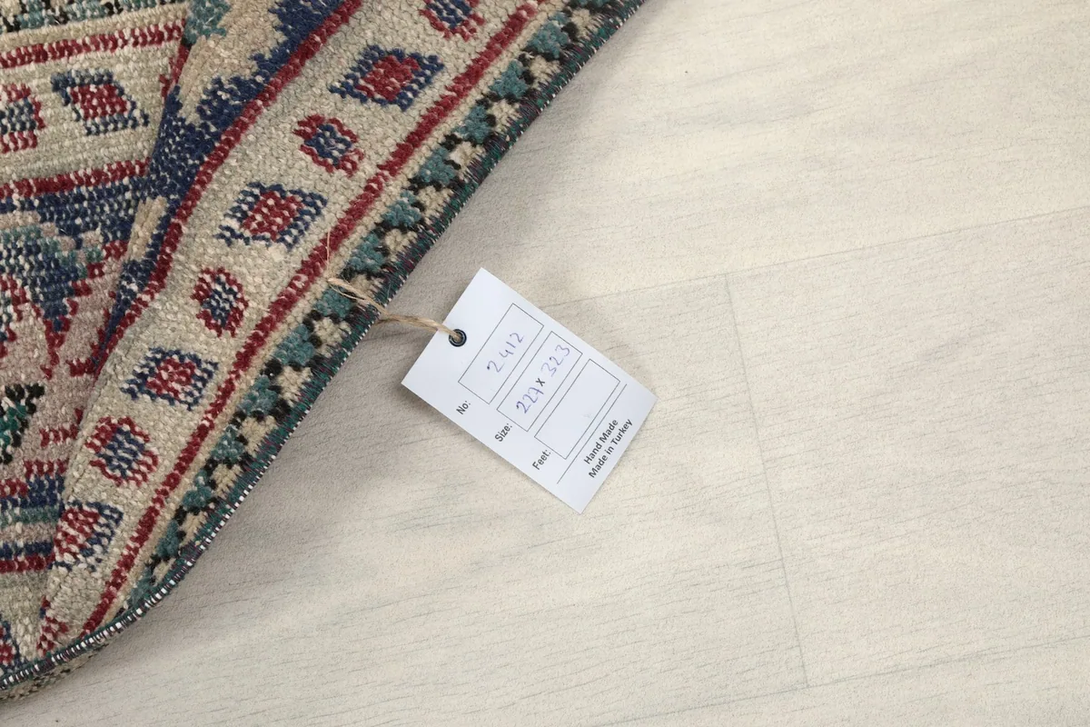 Close-up of the product tag indicating the rug's size and origin