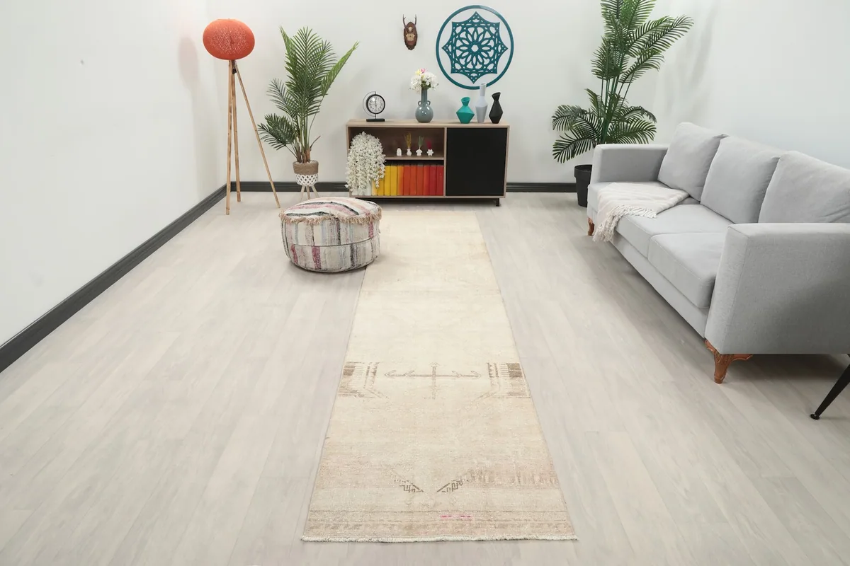 Runner rug in a living room setting, showing its length and neutral tones complementing the decor