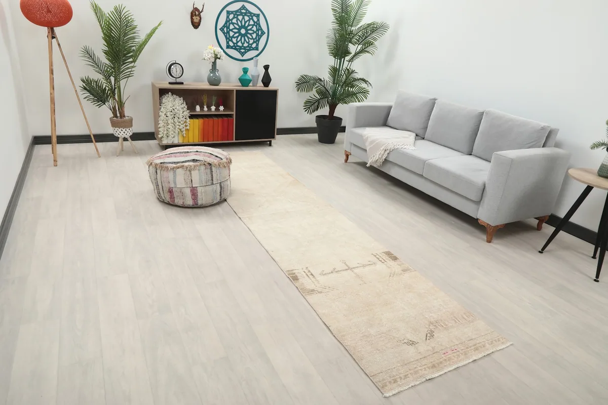 Angle view of the runner rug in a modern living space with a couch and ottoman