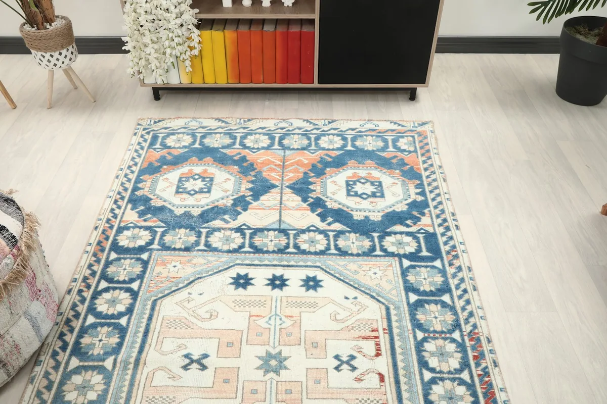 View of the rug in a room setting, focusing on the upper portion and surrounding decor