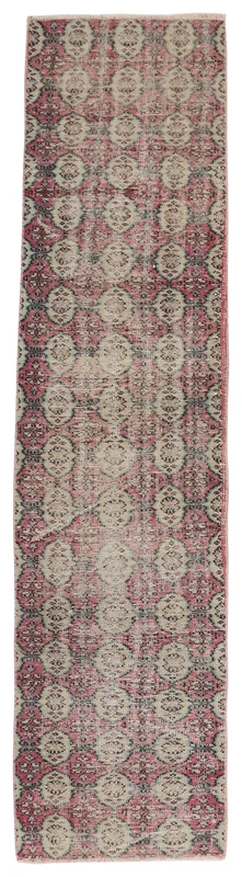 Full top view of the 2'6" x 11'1" rose and beige geometric vintage Anatolian runner rug on a white background.