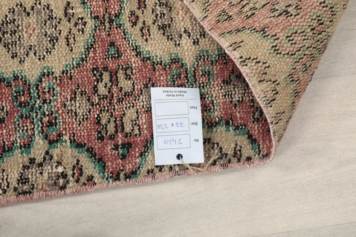 Close-up of the rug's label attached to the back, showing product information.