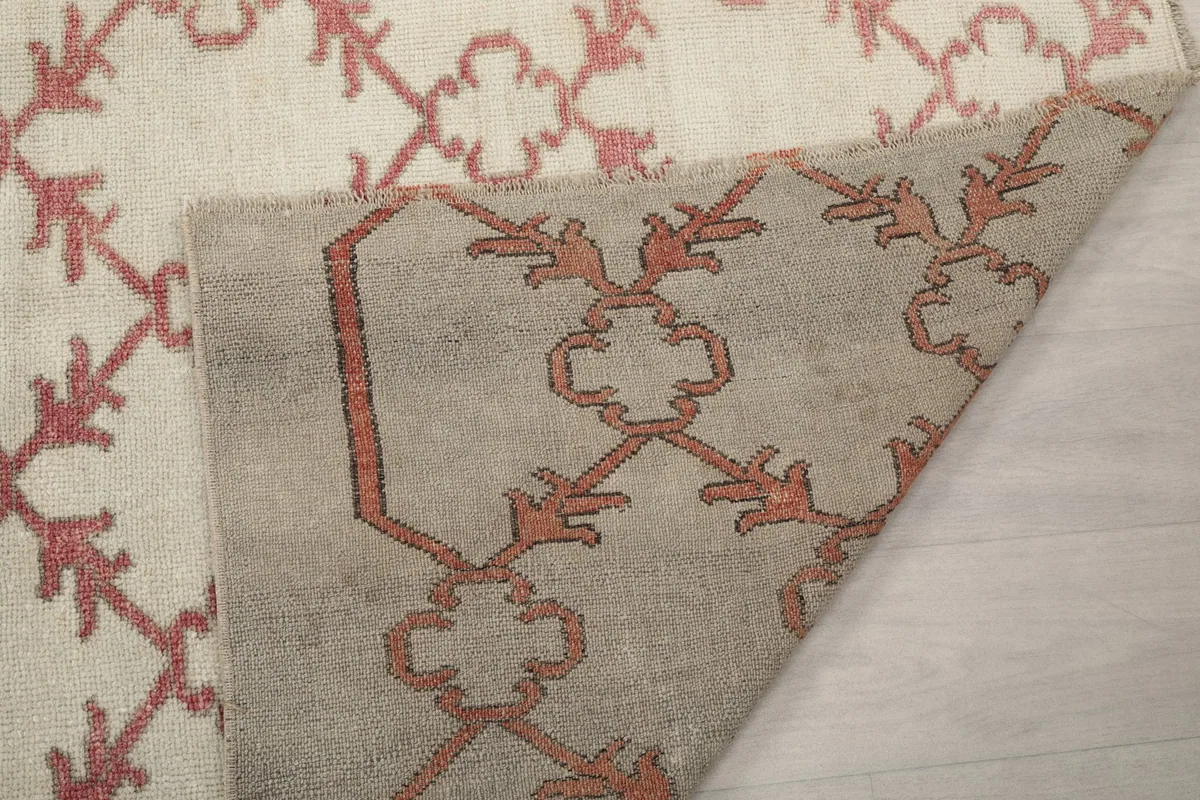 Close-up of the back of the rug, revealing the knotting and foundation structure